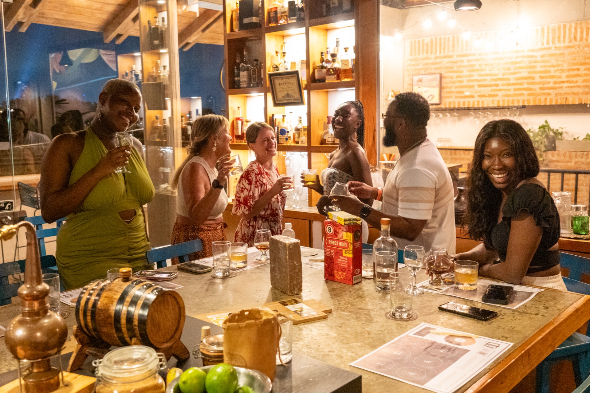 a group of people drinking at a bar