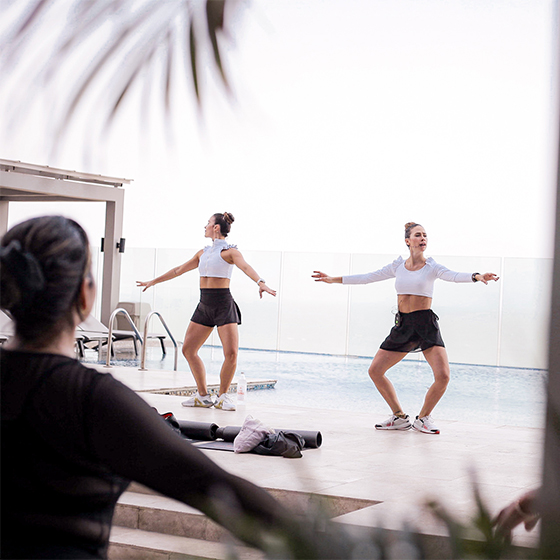 a group of women doing yoga