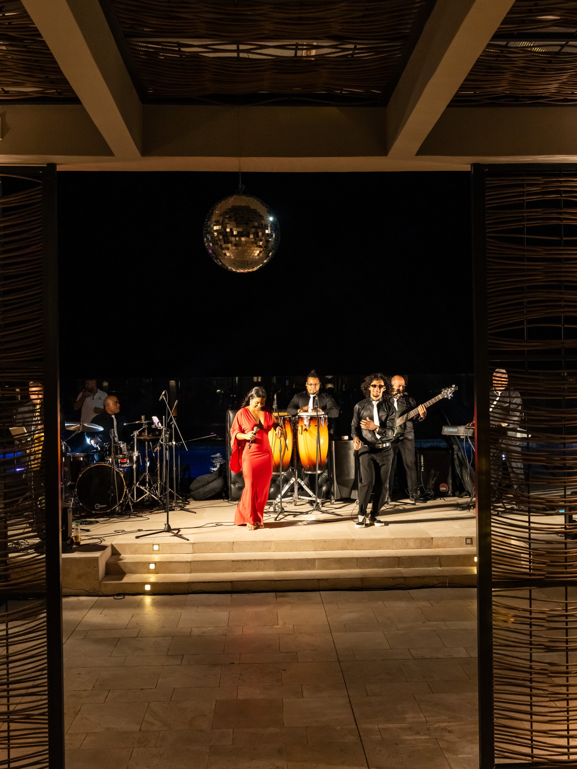 a group of people playing instruments on a stage