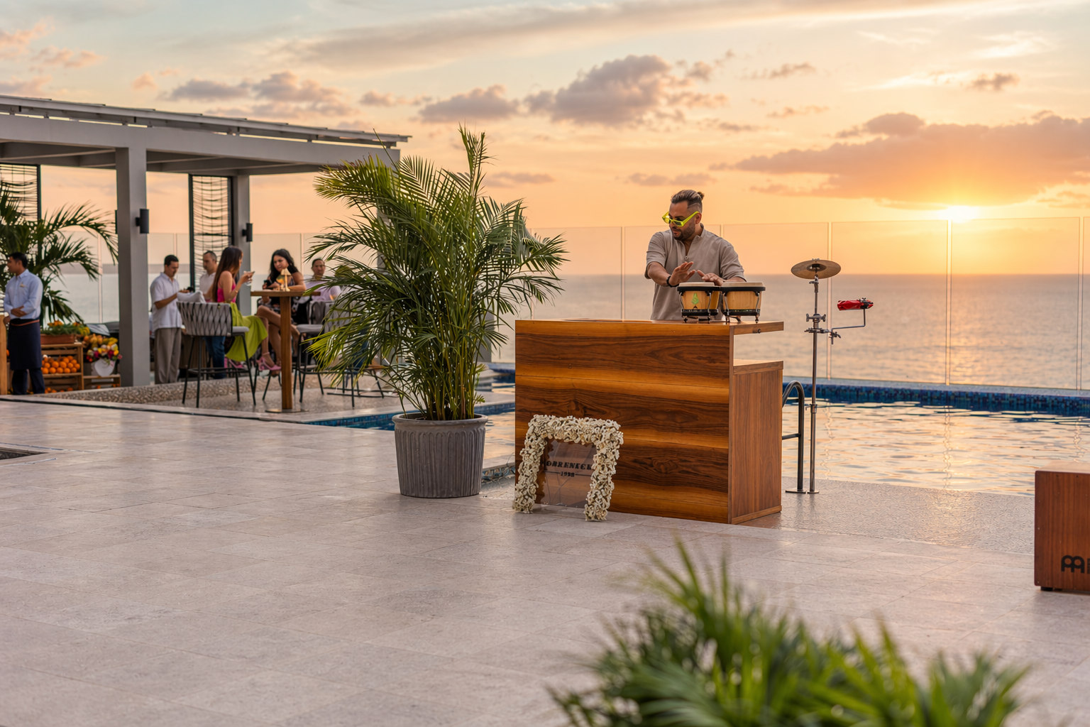a man playing a drum on a table near a pool