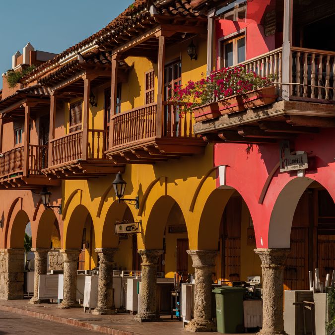 a colorful building with columns and balconies