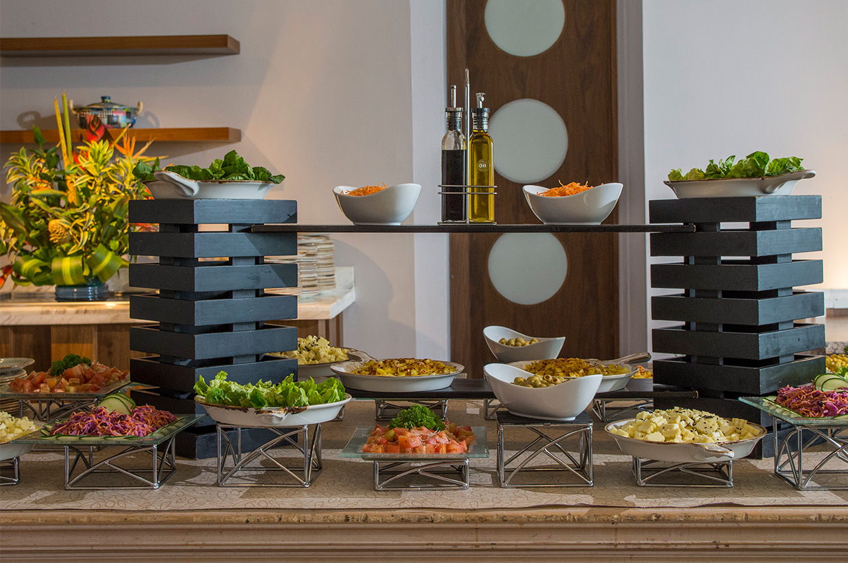 a buffet table with different food items on it