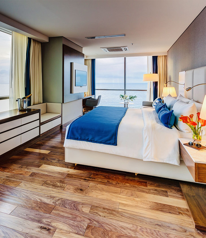 a room with a large bed and a large window