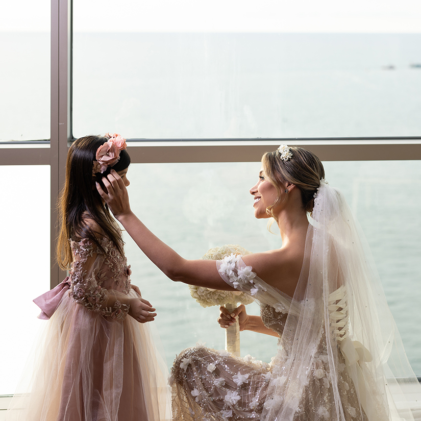 a woman in a wedding dress and a girl in a white dress