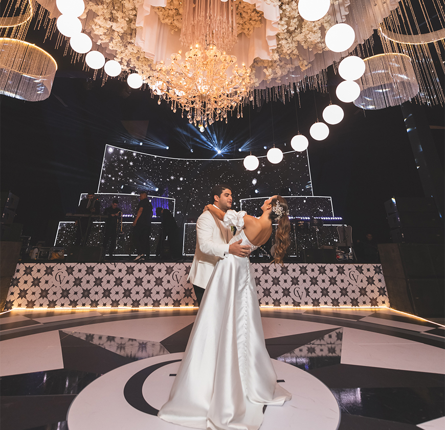 a man and woman dancing in a dance floor