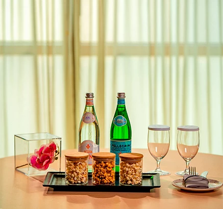a table with food and wine glasses