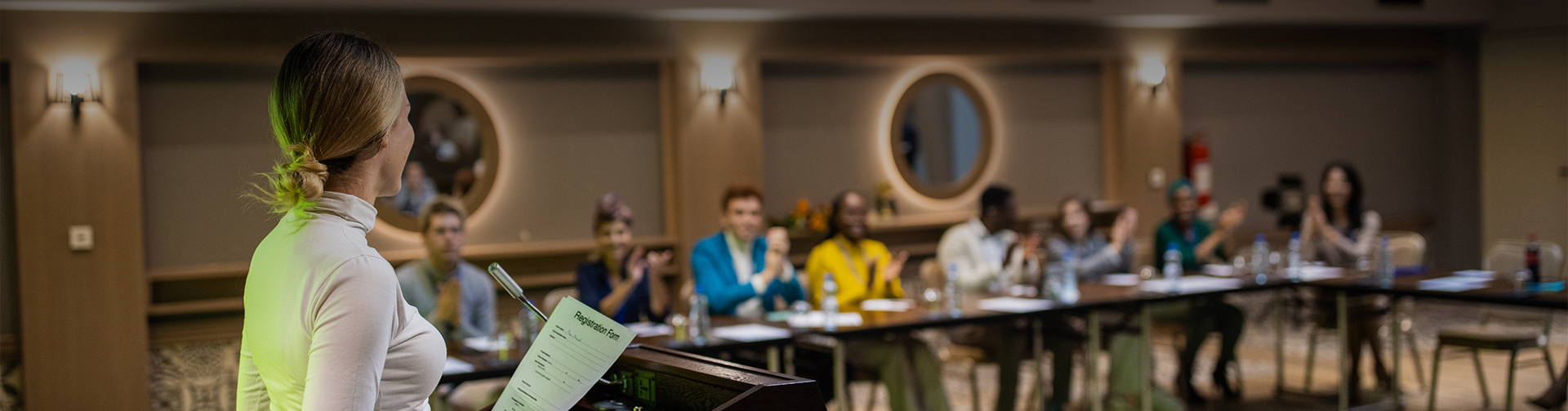 a group of people in a meeting