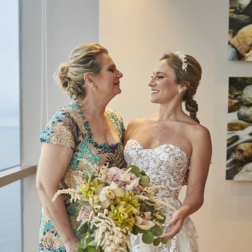 a woman in a dress holding a bouquet of flowers