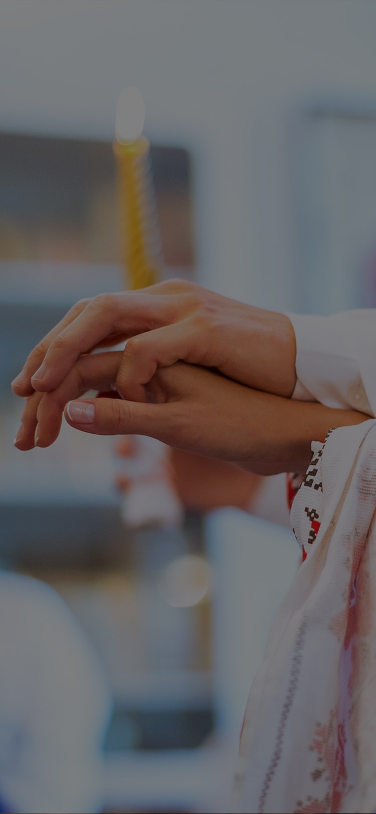 a person's hand holding a syringe