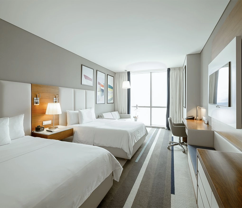 a bedroom with a large window