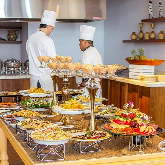 chefs preparing food in a kitchen