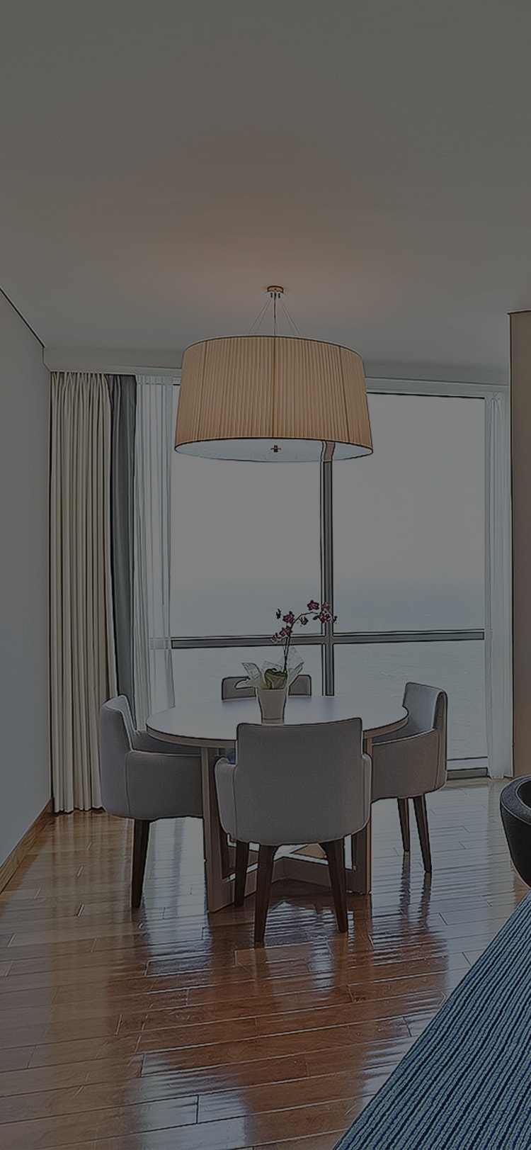 a table with chairs and a lamp