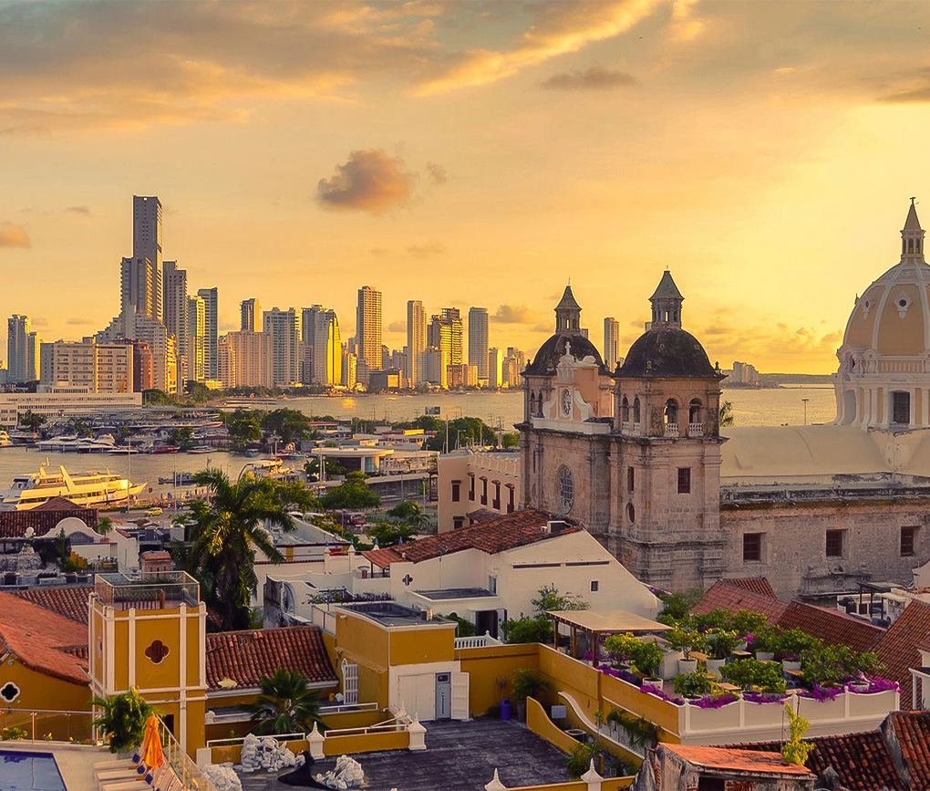a city with a body of water and a city skyline