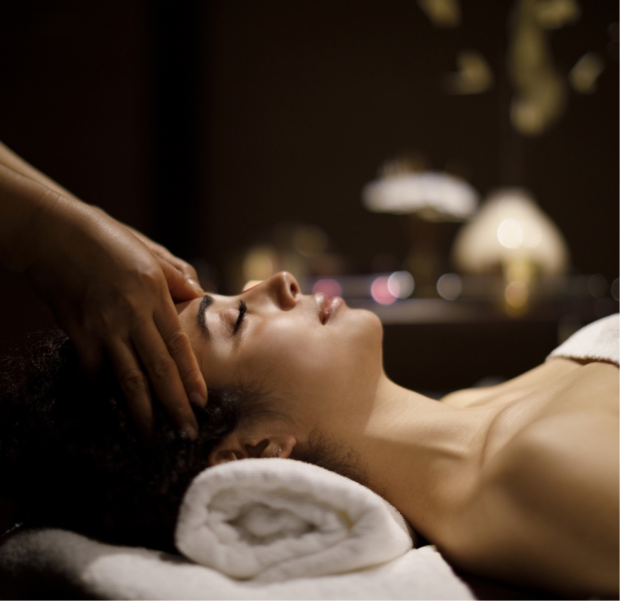 a woman receiving a face massage