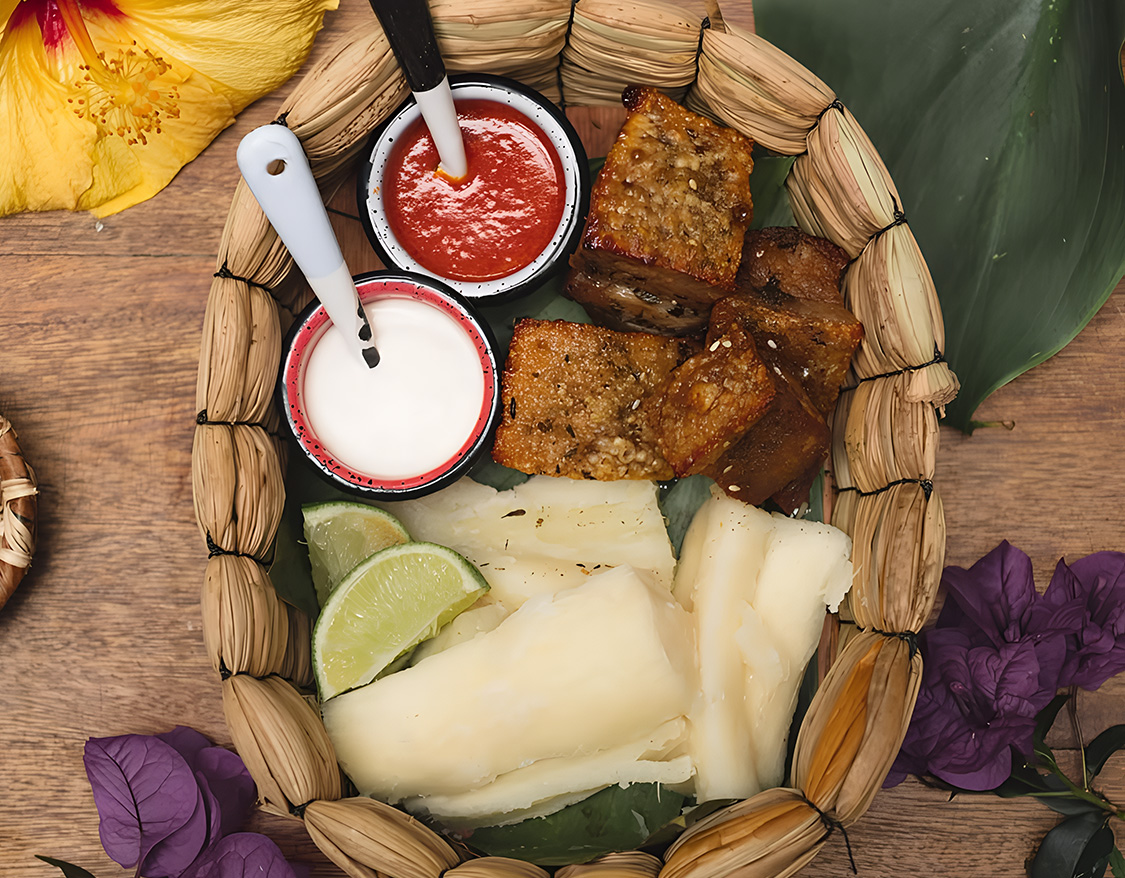 a basket of food with sauces and a fork