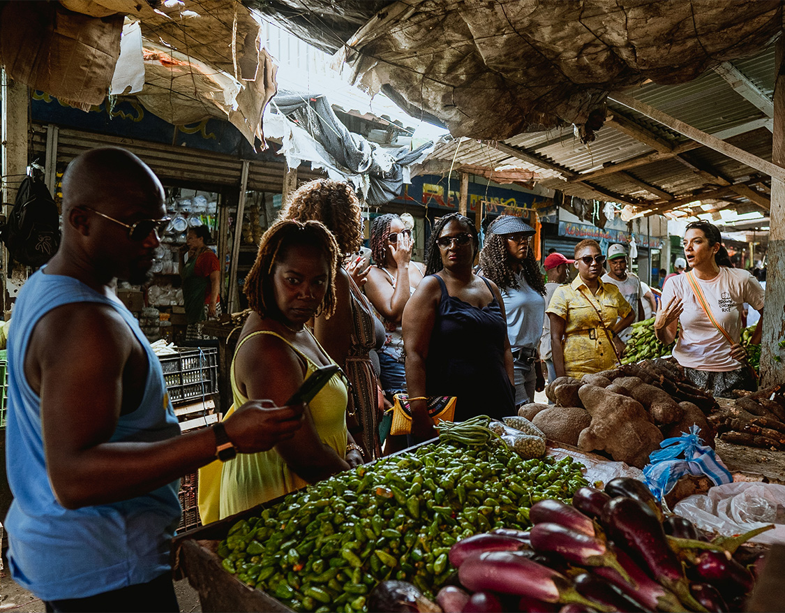 a group of people standing in a market