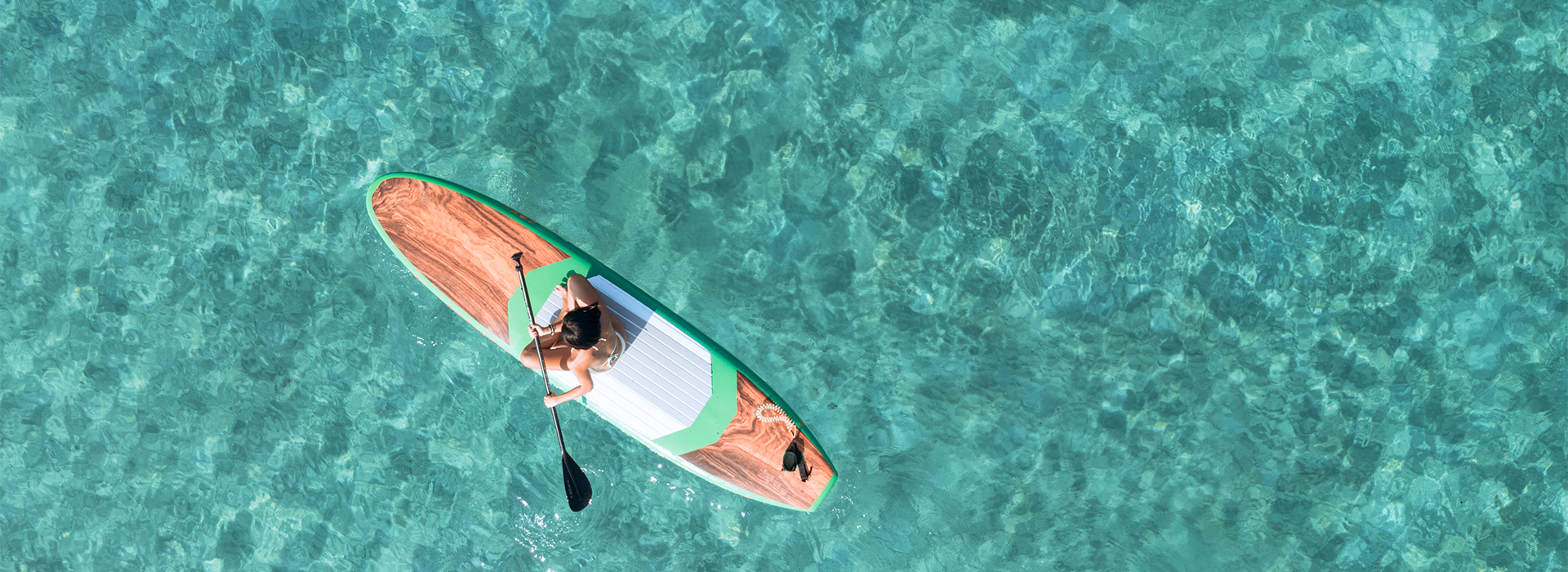 a woman on a paddle board in the water