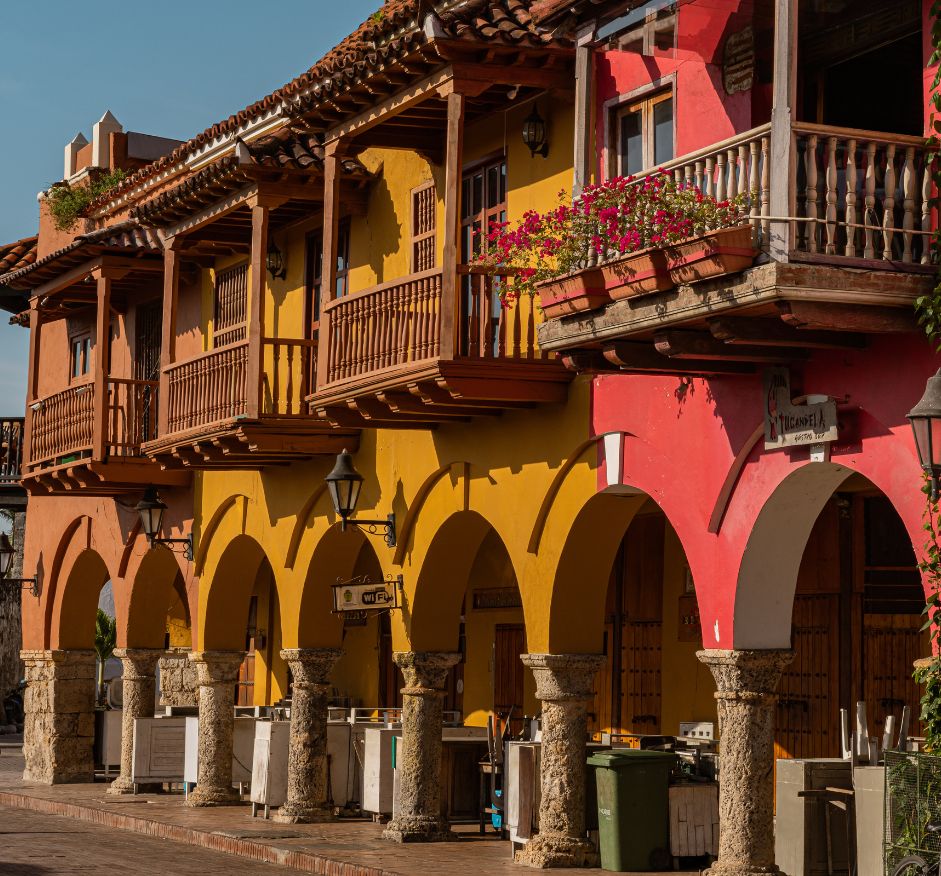 a colorful building with columns and balconies