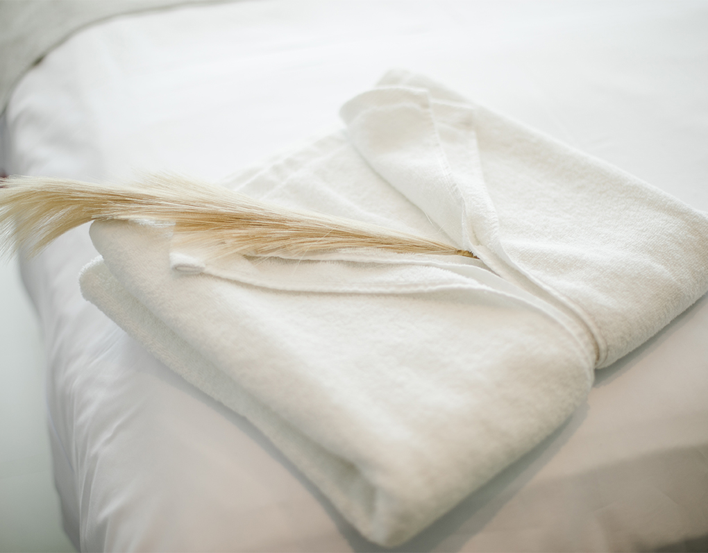a white towel on a white surface