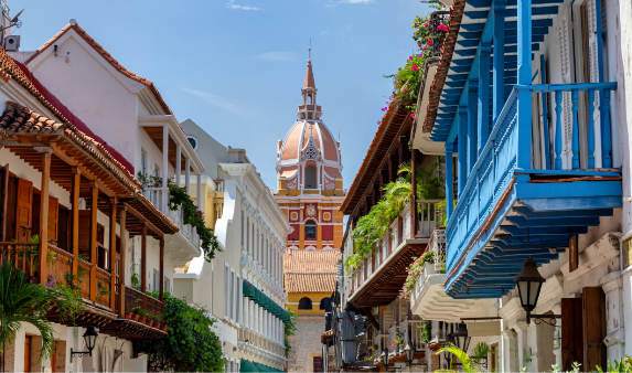 a street with colorful buildings and a dome