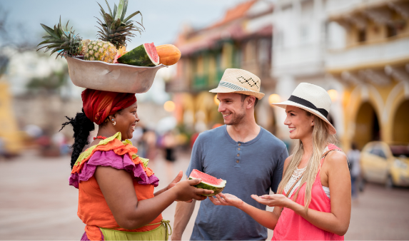 a group of people with fruit on their head