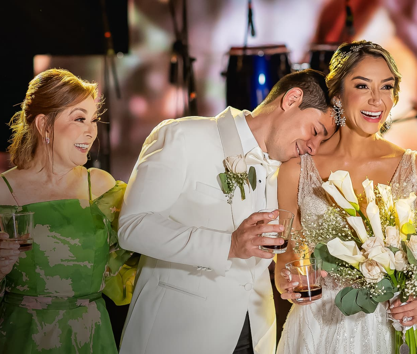 a man in a suit and woman in a white dress
