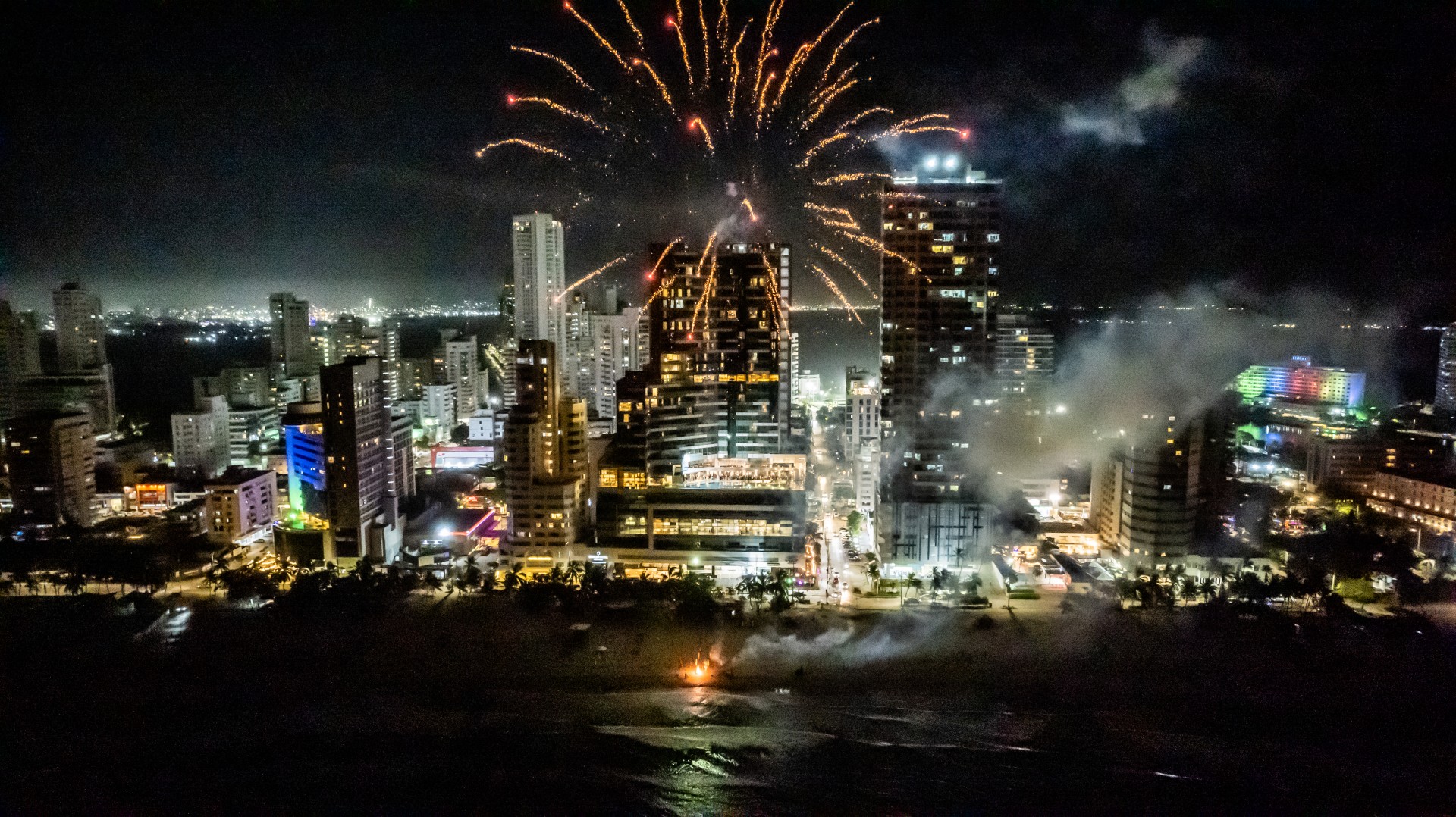 fireworks in the sky above a city