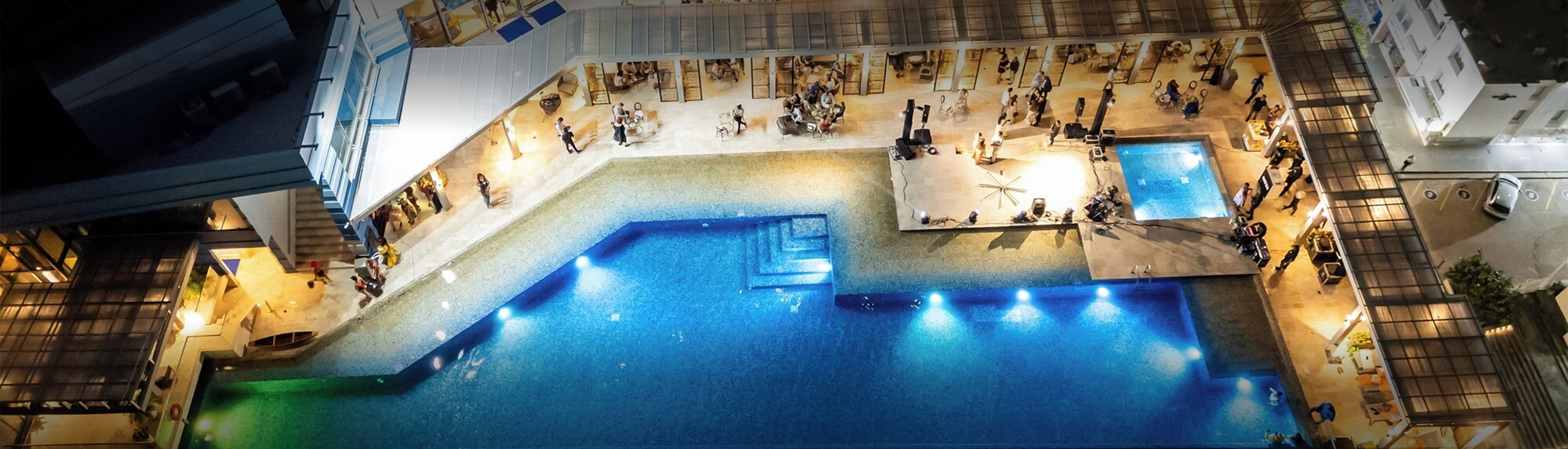 a pool with people around it