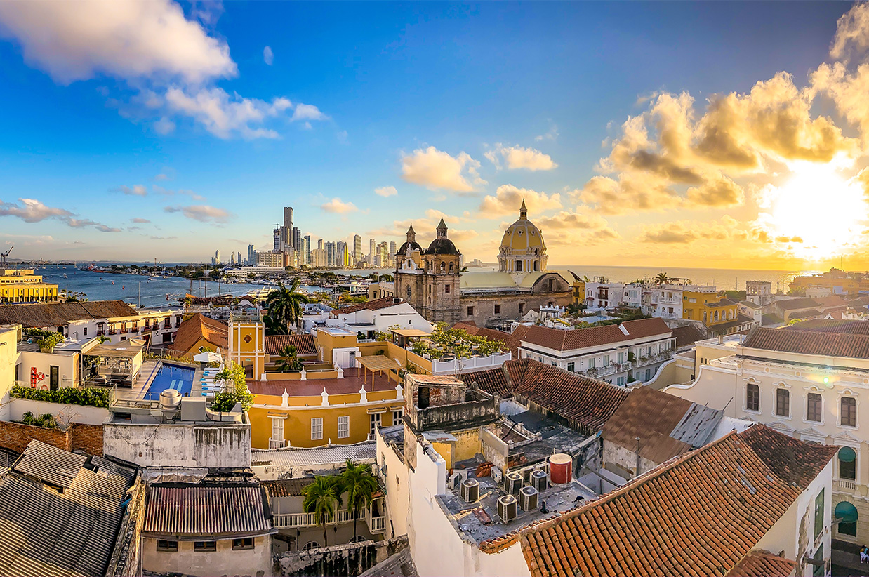 a city with a body of water and a city skyline