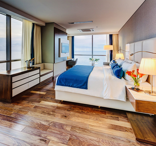 a room with a large bed and a window