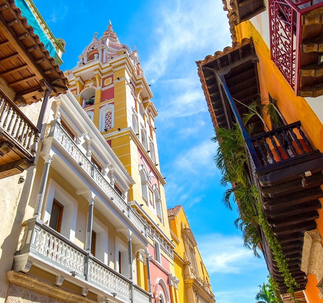 a colorful buildings with a bell tower