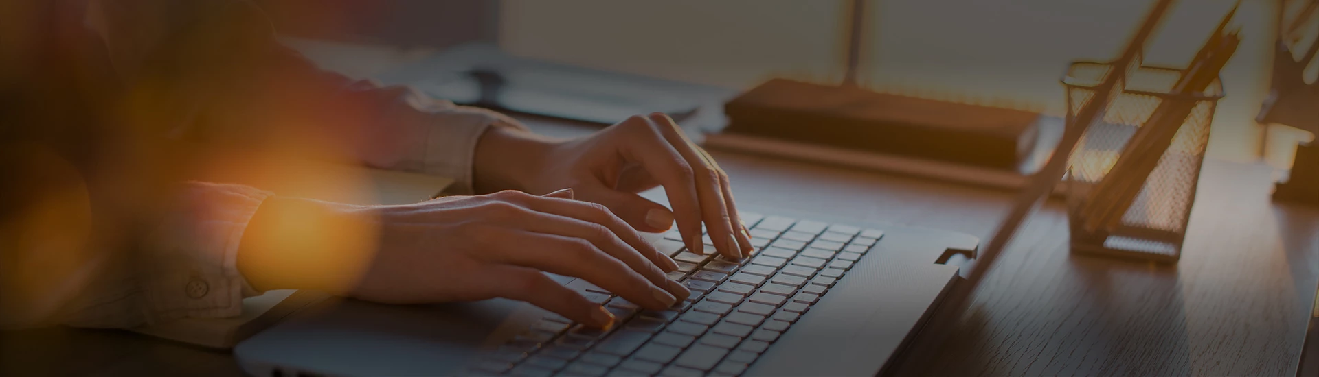 a person typing on a keyboard