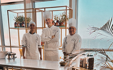 a group of men wearing chef's hats