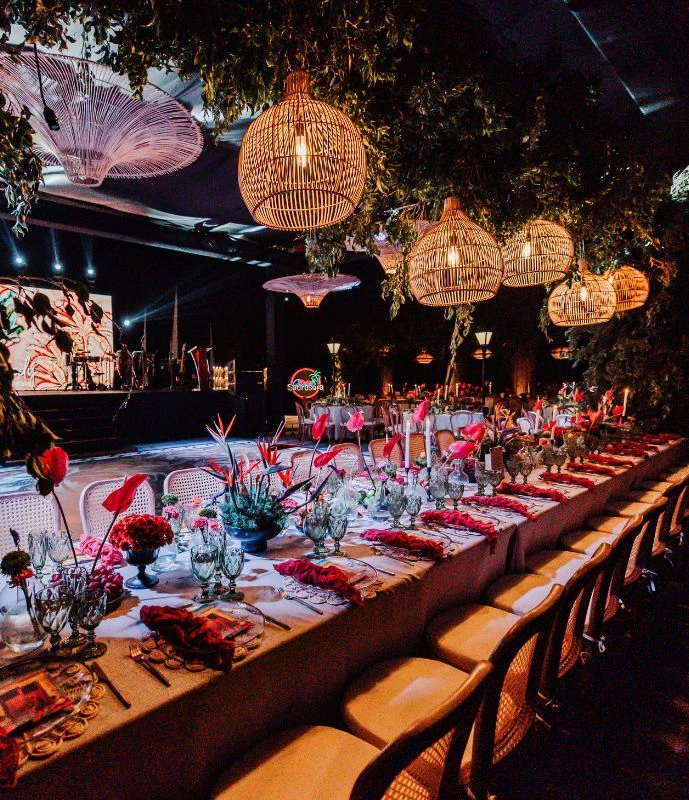 a long table with flowers and chairs