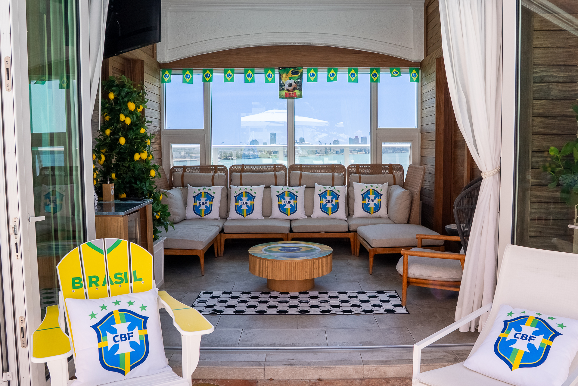 a room with a couch and chairs