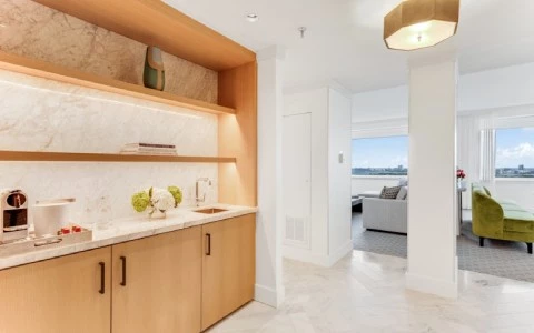 a kitchen with a couch and a table