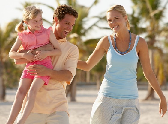 A family playing in the sand