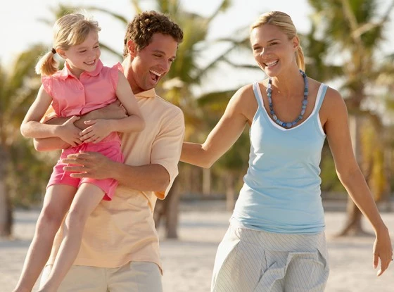 A family playing in the sand