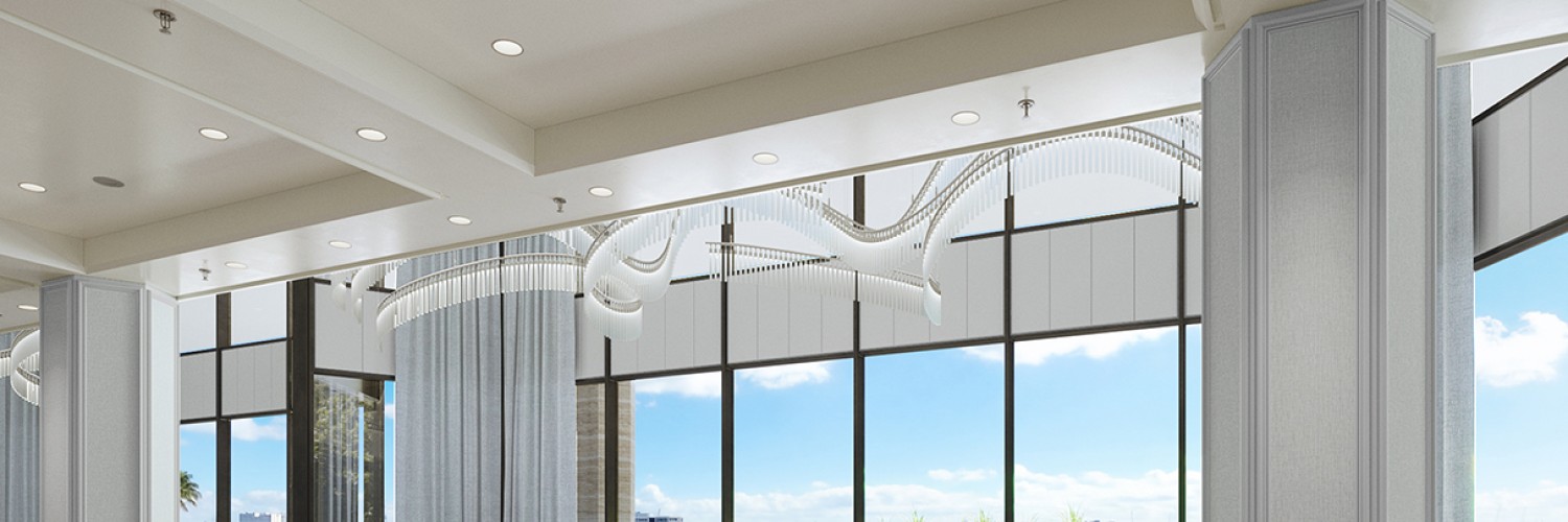a room with large windows and a view of the water