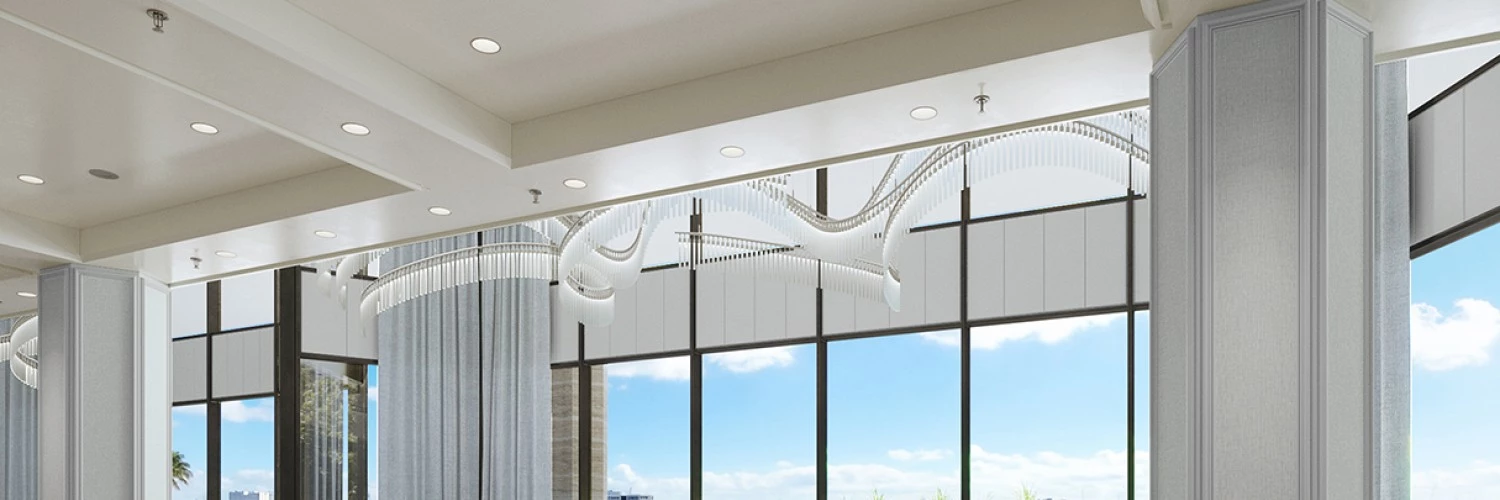 a room with large windows and a view of the water