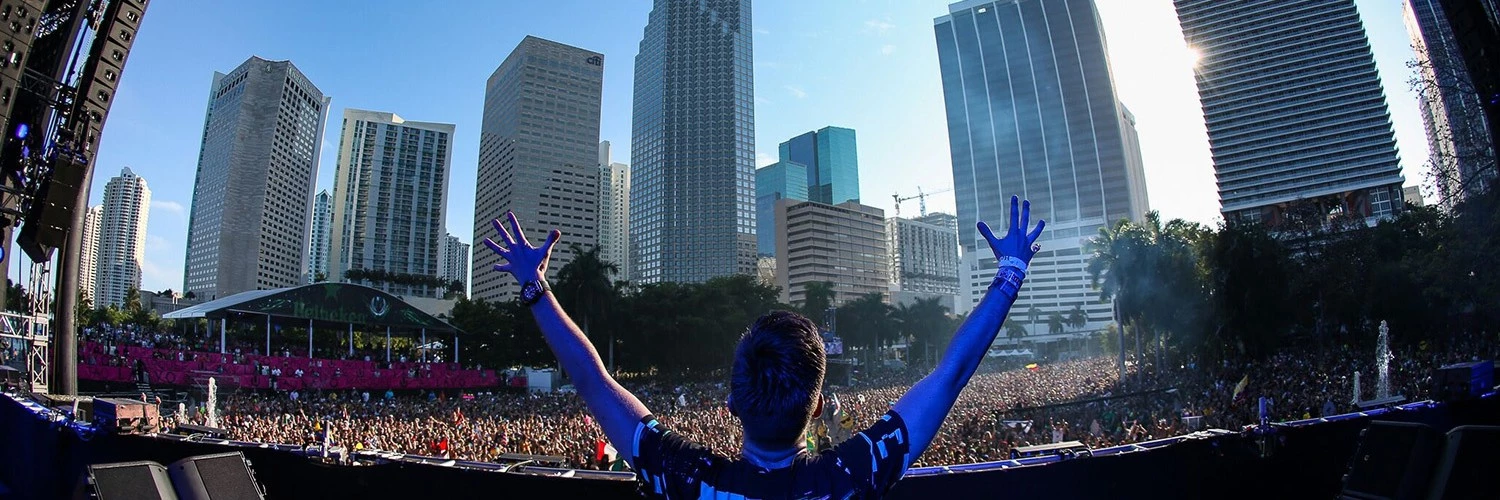 dj playing in front of large crowd