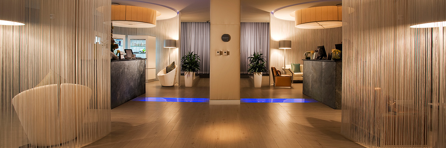 a room with a large wall and a large mirror