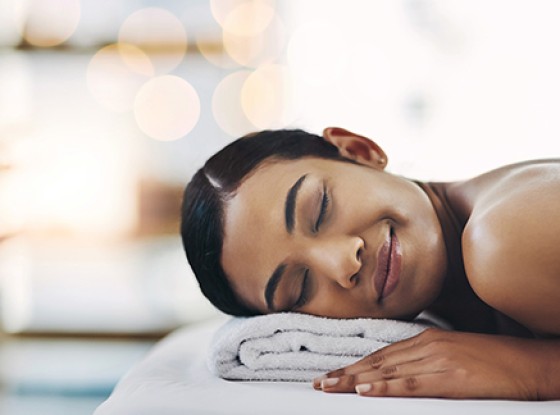 a person lying on a towel