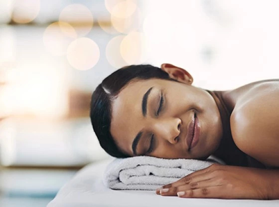 a person lying on a towel