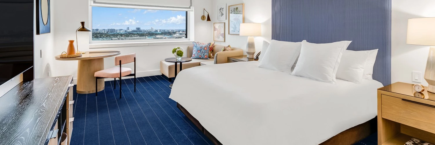 a bedroom with a bed and a desk