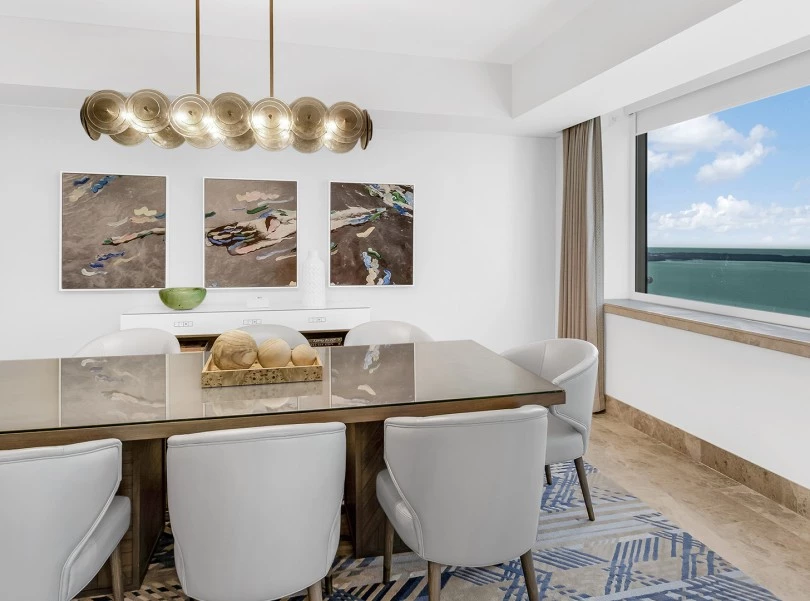 a room with a table and chairs