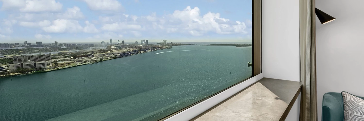 a window overlooking a body of water