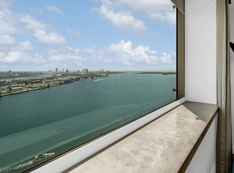 a window overlooking a body of water