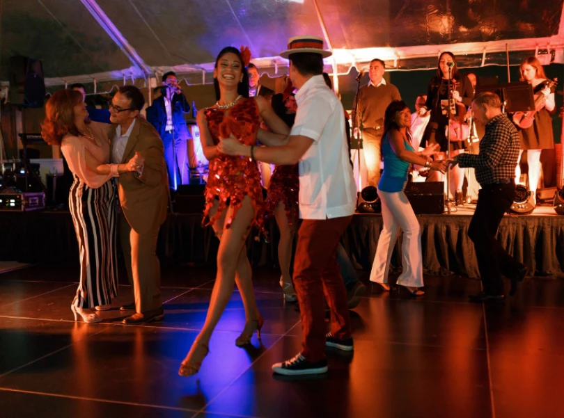 a group of people dancing on a stage