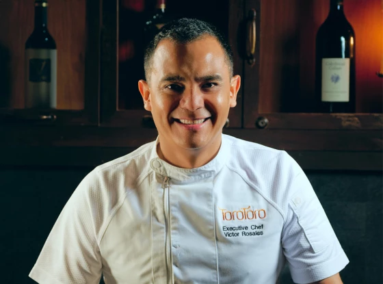 a man in a white chef's uniform